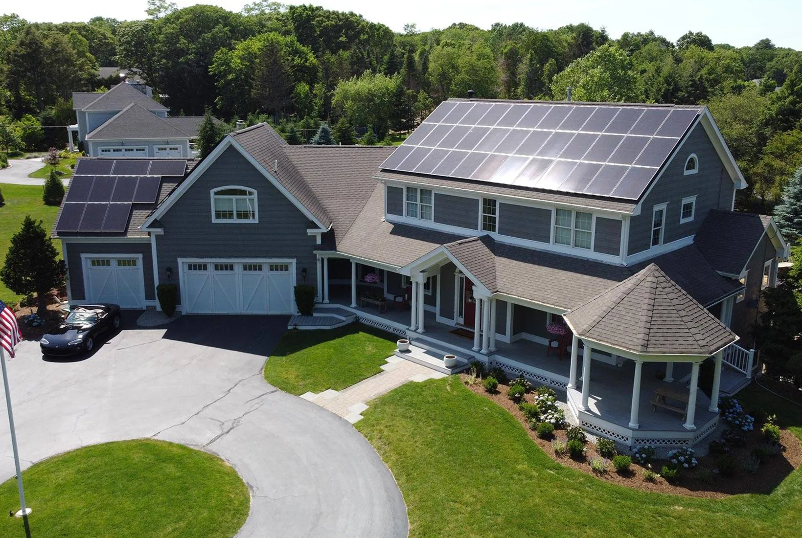 Home with rooftop solar panels and EV charger add-ons