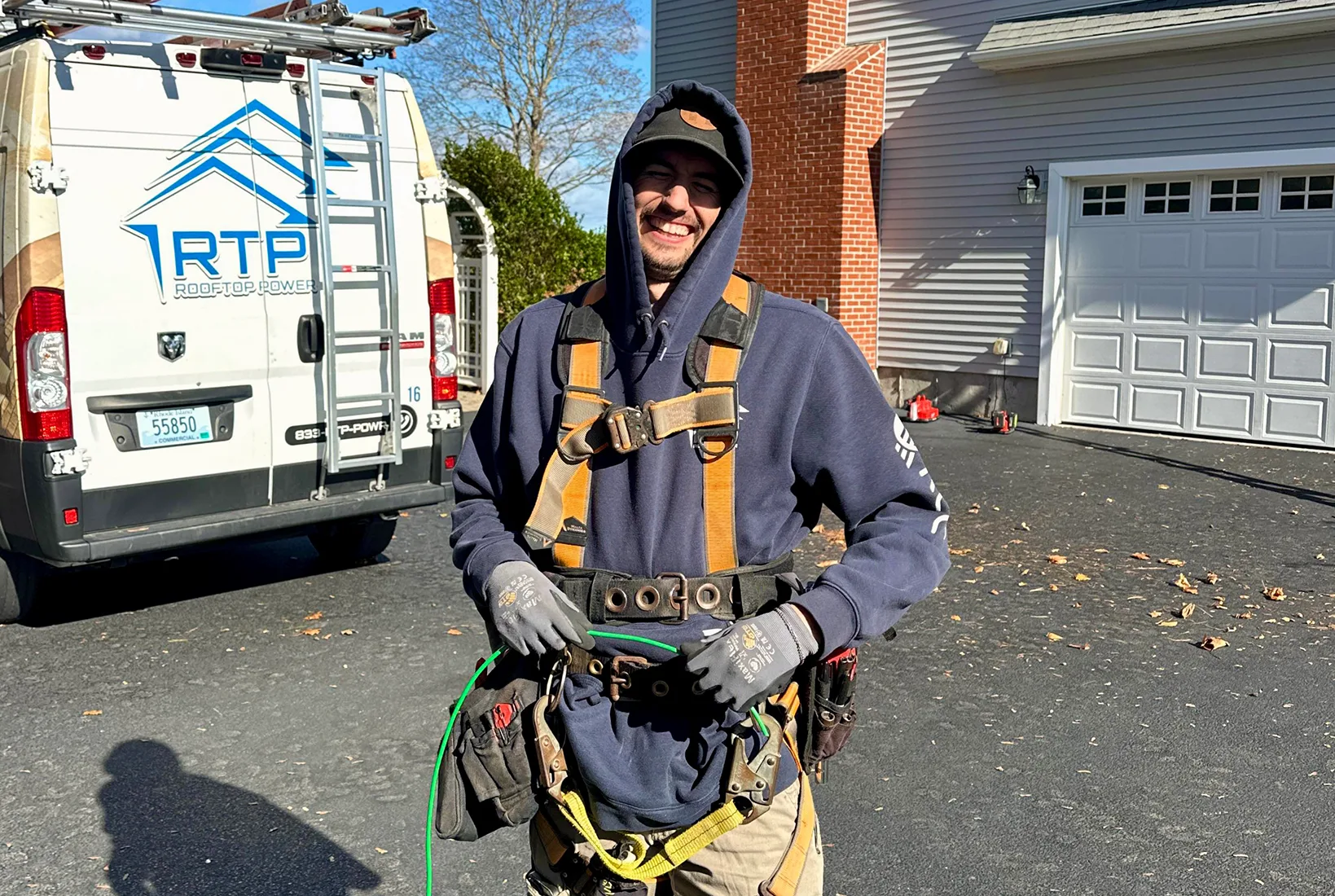 Technician removing and reinstalling solar panels on a roof