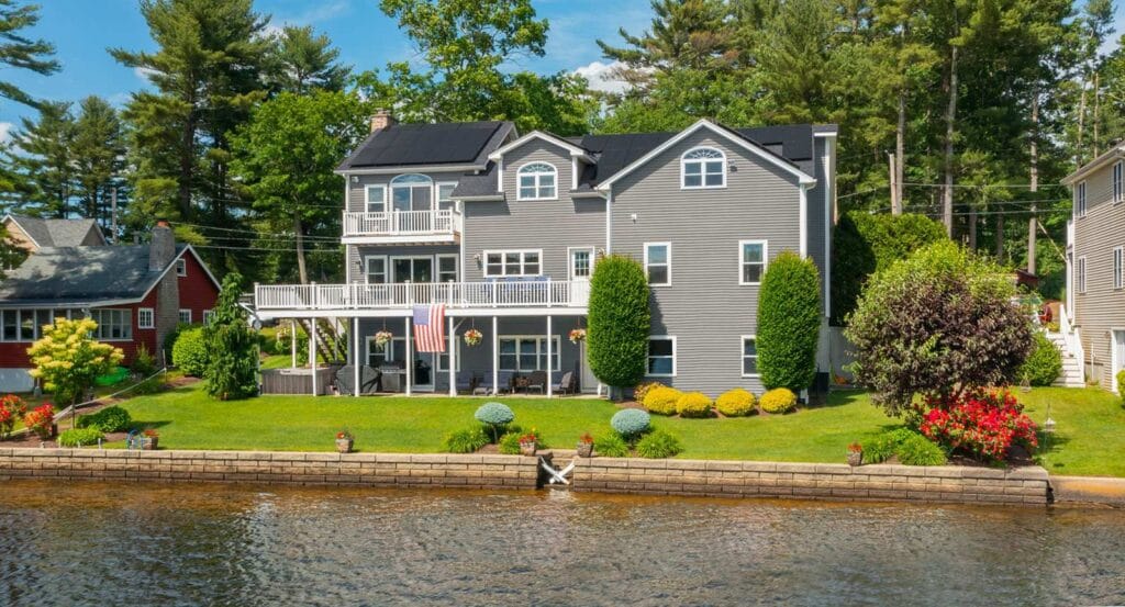 Waterfront colonial home with solar panel installation by Rooftop Power, New England energy upgrades.