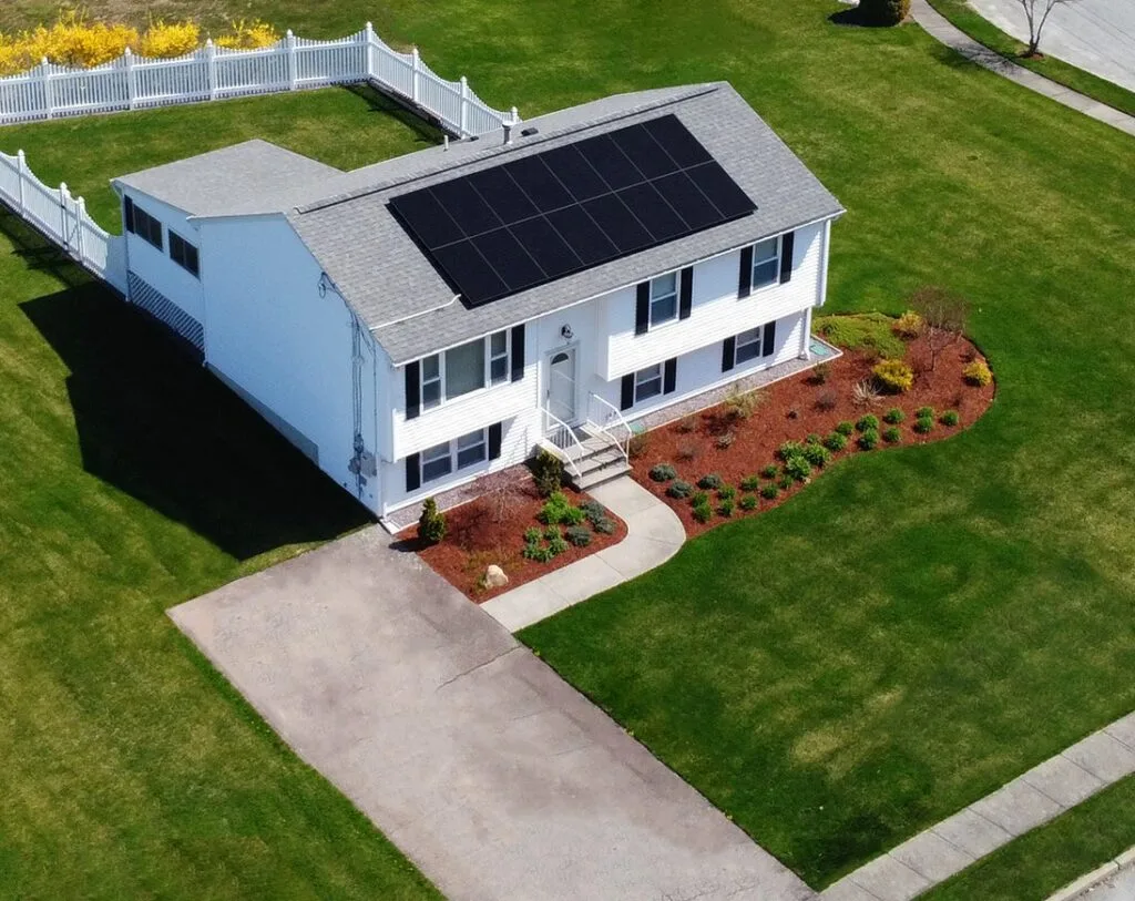 Aerial view of Rooftop Power solar on a white raised ranch