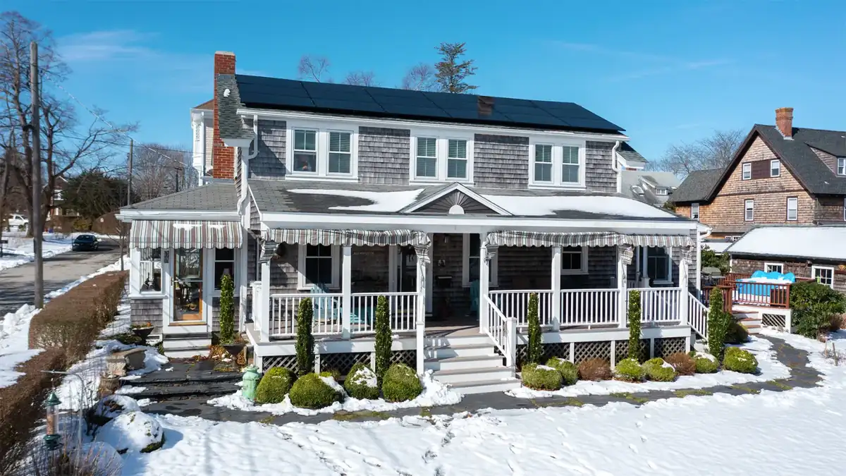 Rhode Island home with a rooftop solar panel array